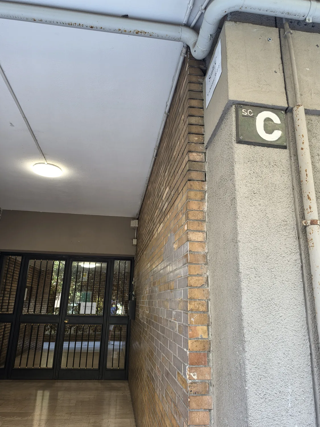 Scala C plaque at the entrance of the building