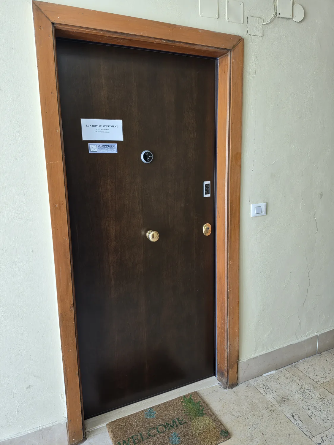 The apartment door on the 7th floor with the digital peephole and doorbell
